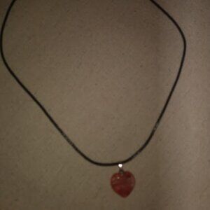 Orange color heart shaped stone pendant necklace.
